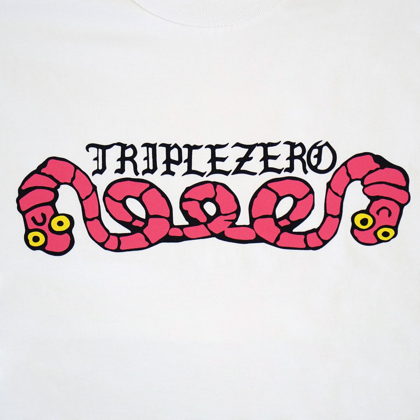 white tshirt with pink print of a worm